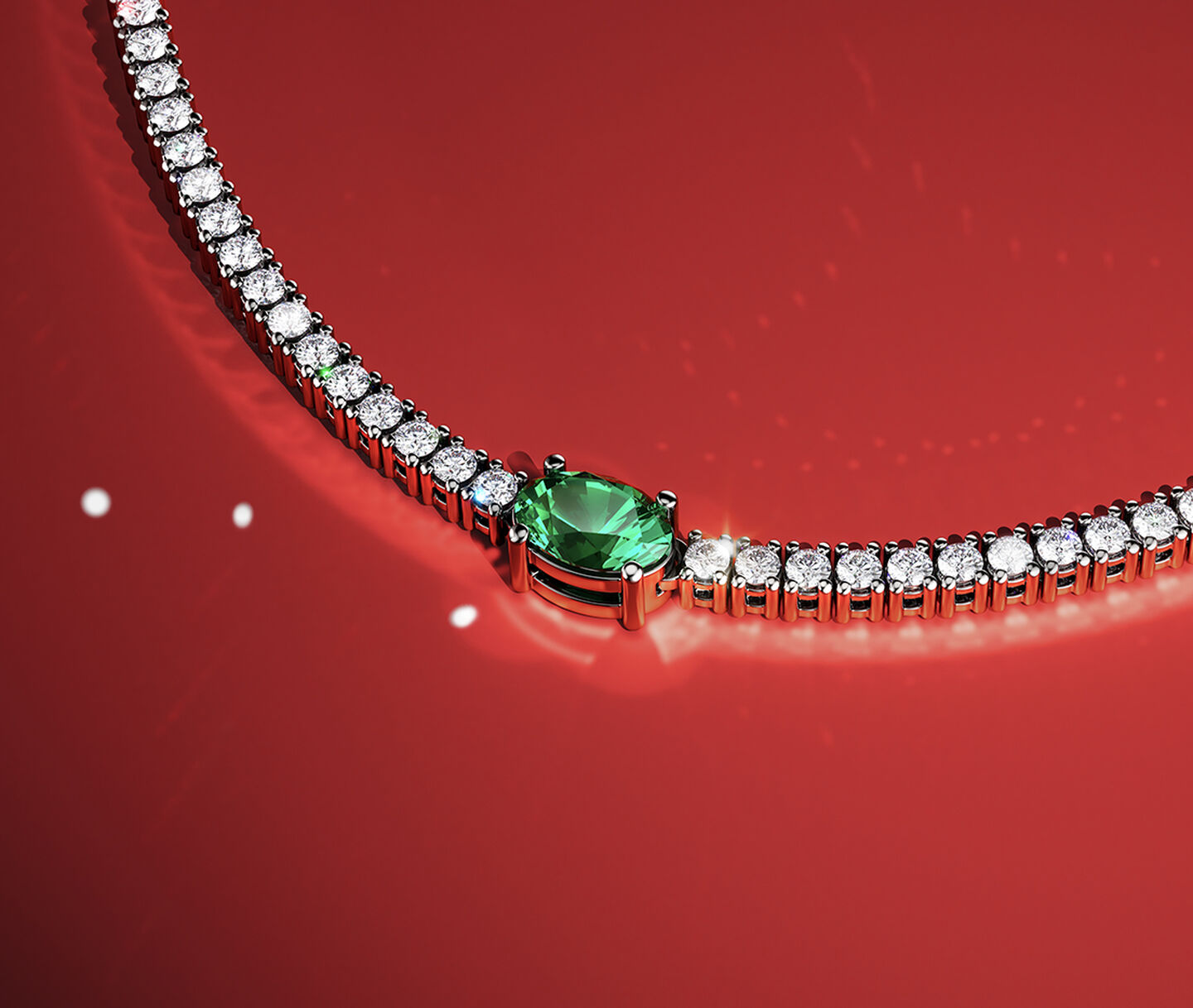 Birks essential line diamond and emerald necklace on a red holiday background.