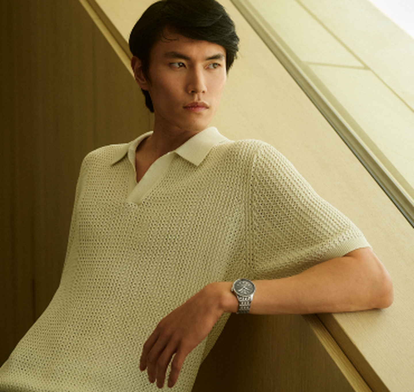 A men's Breitling watch on a male model