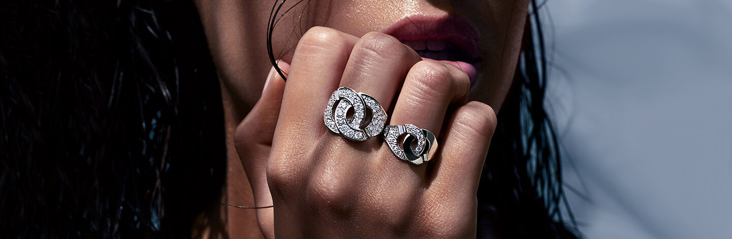 Woman wearing dinh van Menottes diamond rings