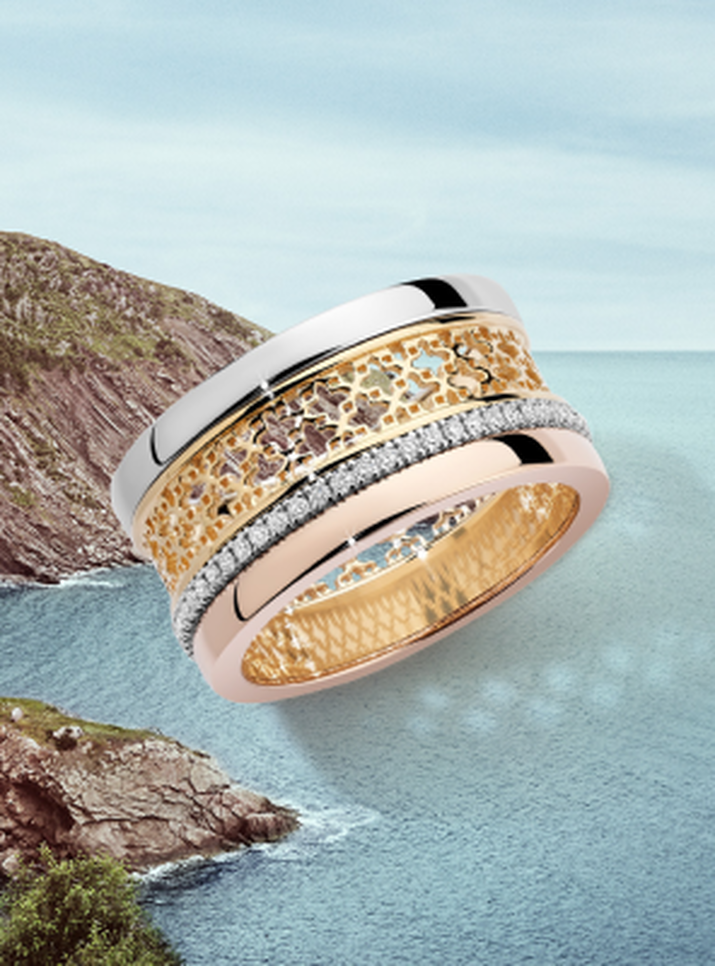 A Birks Dare to Dream Ring on beach background.