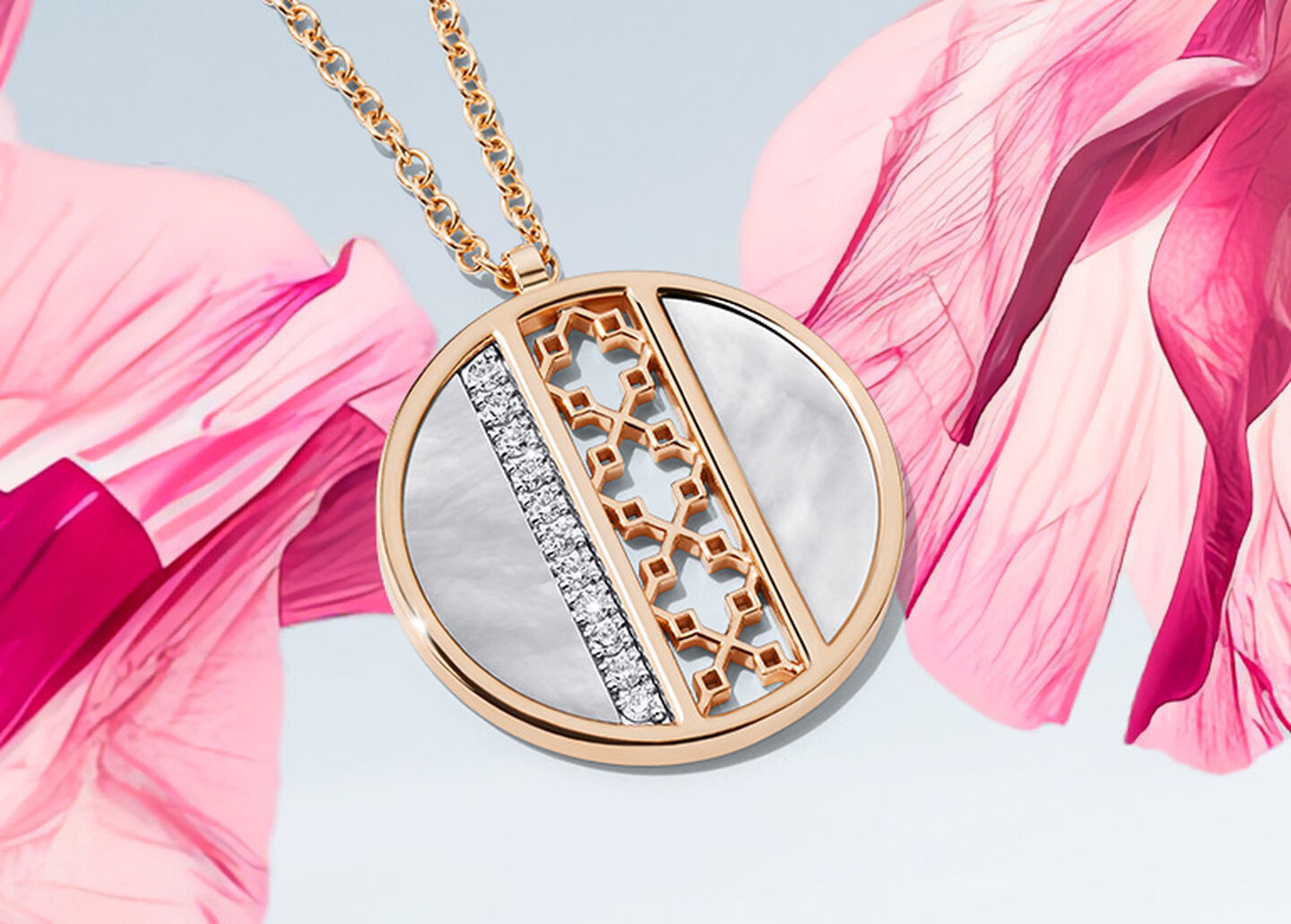 A Birks Dare to Dream mother-of-pearl and diamond medallion on a pink flower and light sky blue background.