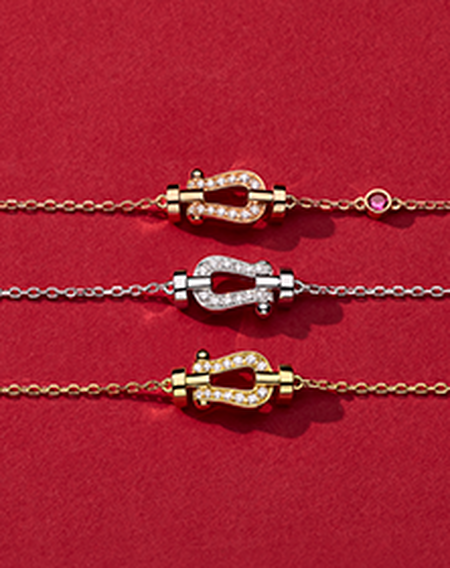 FRED Force 10 diamond jewellery on a red background.