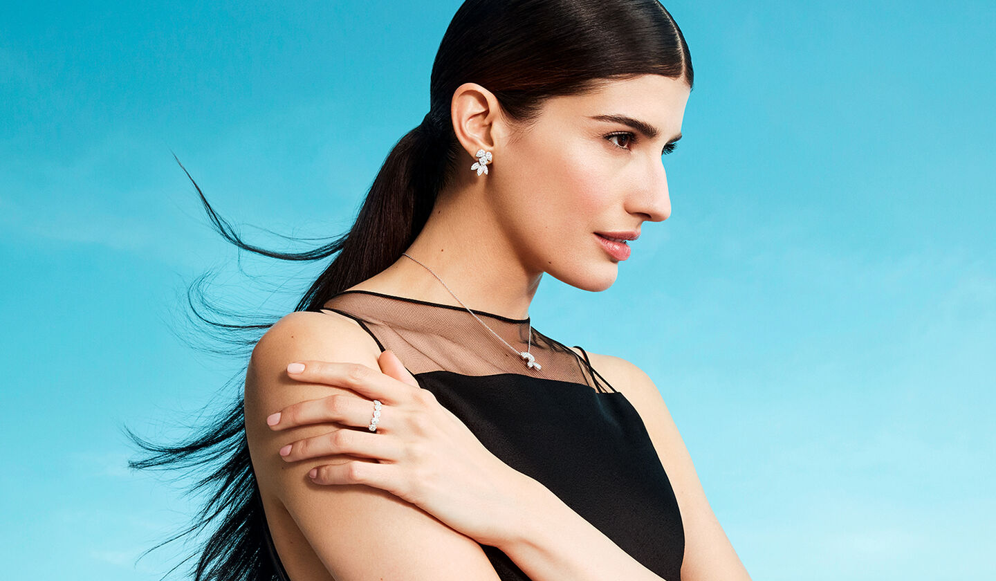 A woman wearing Birks Snowflake jewellery.