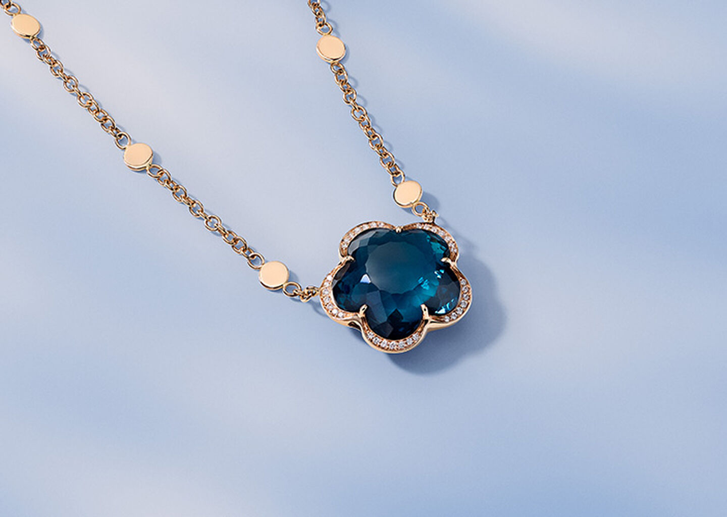 Pasquale Bruni Bon Ton necklace on a blue background.