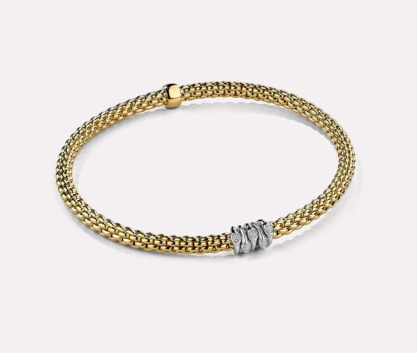 FOPE 18kt yellow gold and diamond eka flex bracelet on a beige background.
