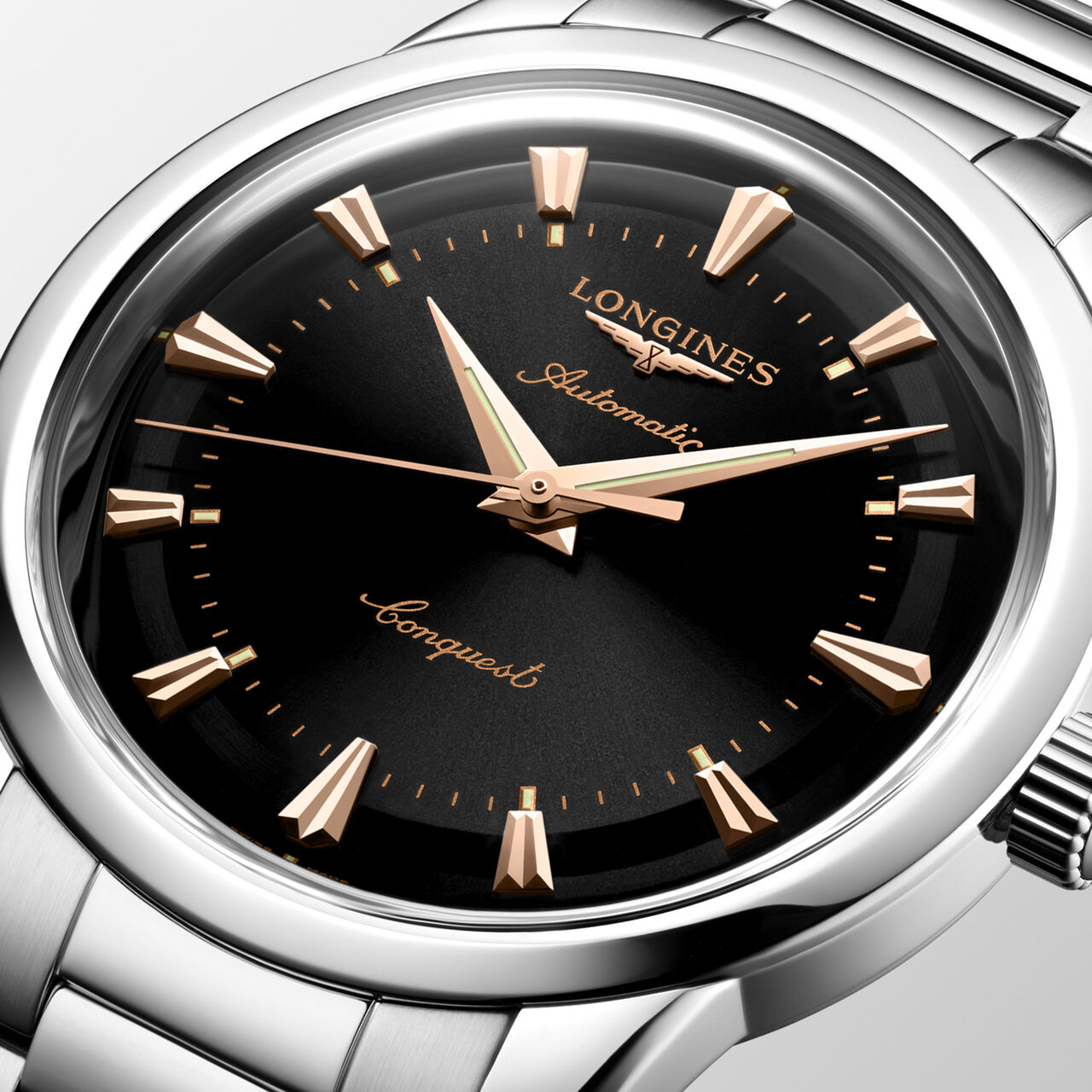 Close-up of black dial with gold hands and round stainless steel case image number 3
