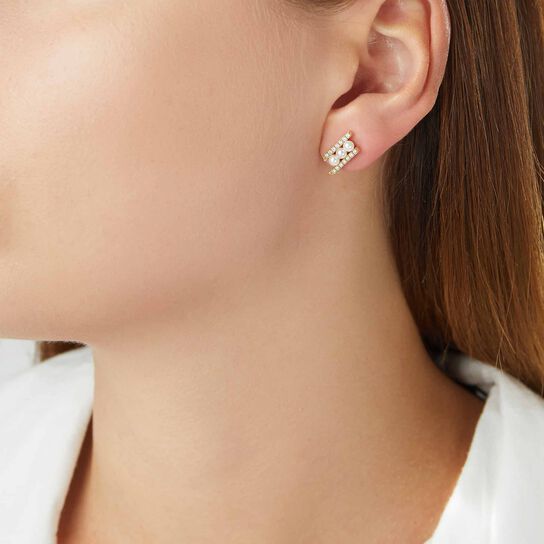 yoko london sleek yellow gold 3 pearl diamond stud earrings qye2227 6x on model image number 2