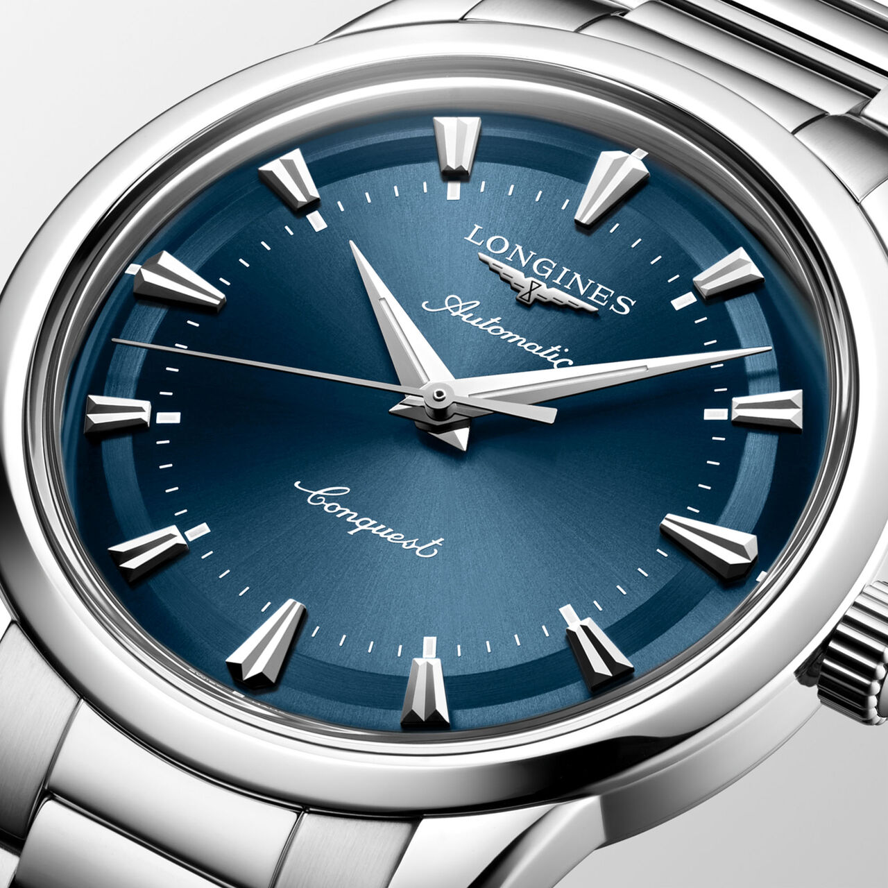Close-up of blue dial with silver hands and round stainless steel case image number 2