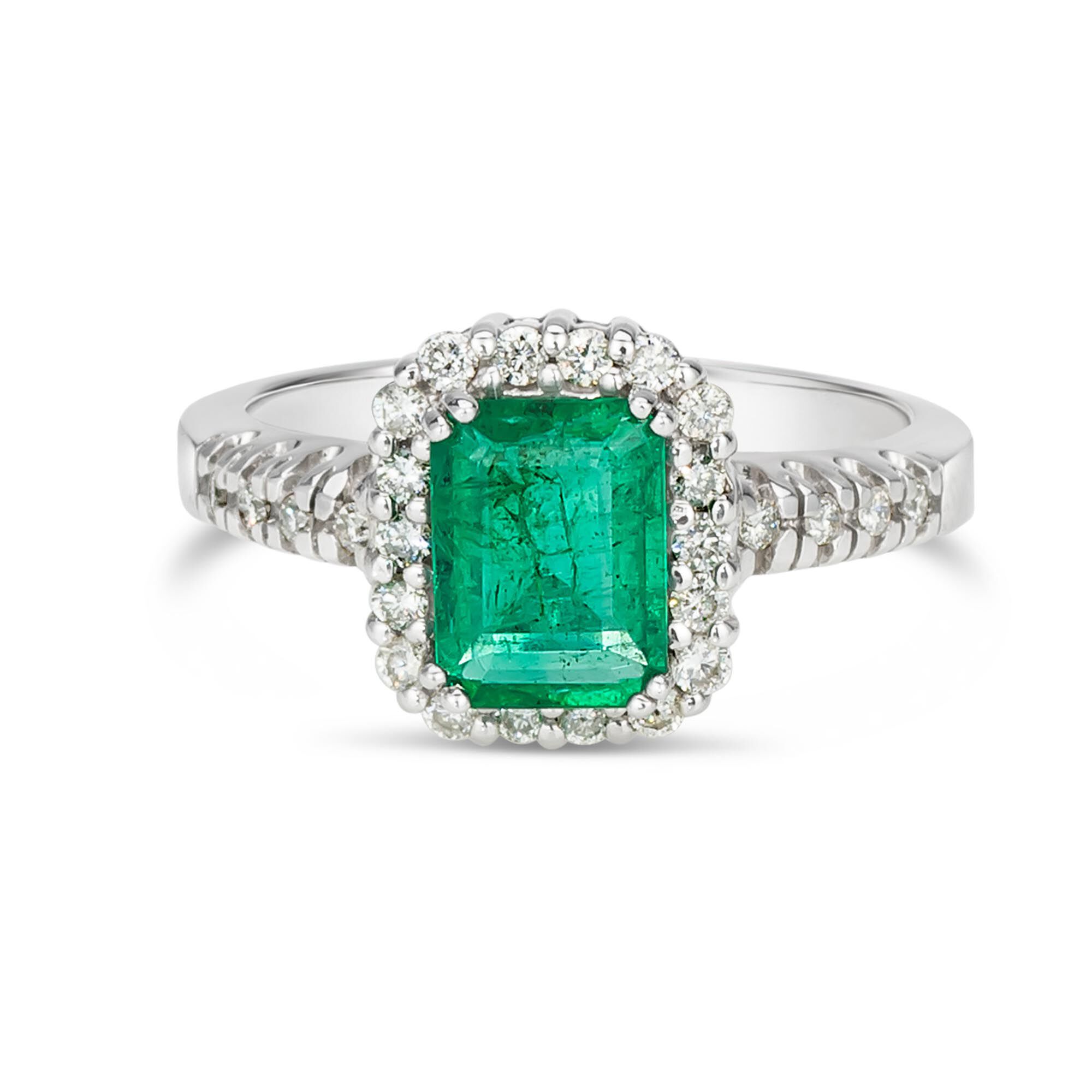 Emerald surrounded discount by diamonds ring
