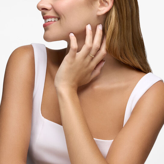 On model view of Birks Iconic stackable ring in 18k yellow gold, featuring diamonds in a splash-inspired design image number 1