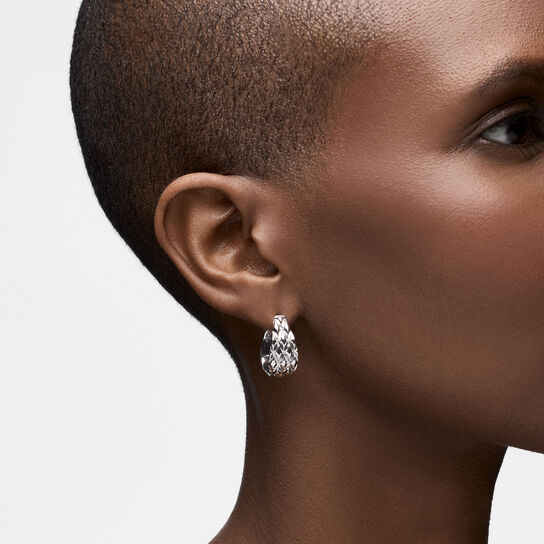 On-model view of Birks Essentials silver serpent hoops worn on the ear image number 1