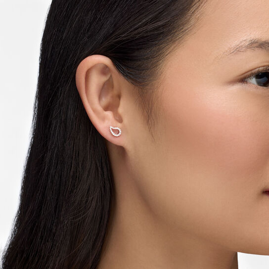 On-model view of Birks P&eacute;tale diamond stud earrings worn on the ear image number 1