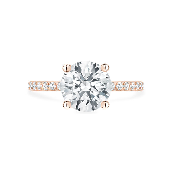 Bague de fiançailles en or rose à diamant solitaire rond avec anneau serti de diamants