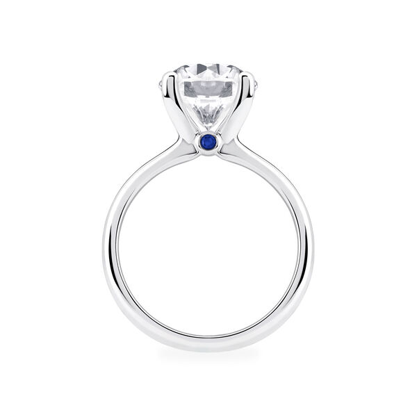 Platinum Round Diamond Solitaire Engagement Ring with Sapphire Accent