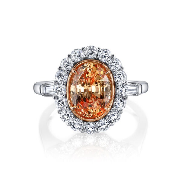 Bague avec saphir orangé avec halo de diamants