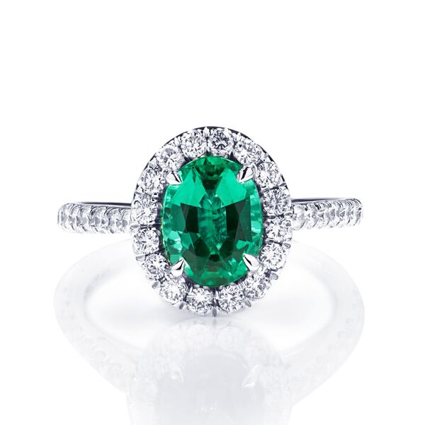 Oval-Cut Emerald and Diamond Ring With Halo