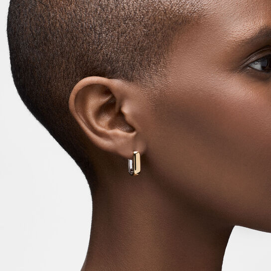 On-model view of Birks Essentials reversed yellow and white gold hoops worn on the ear image number 2