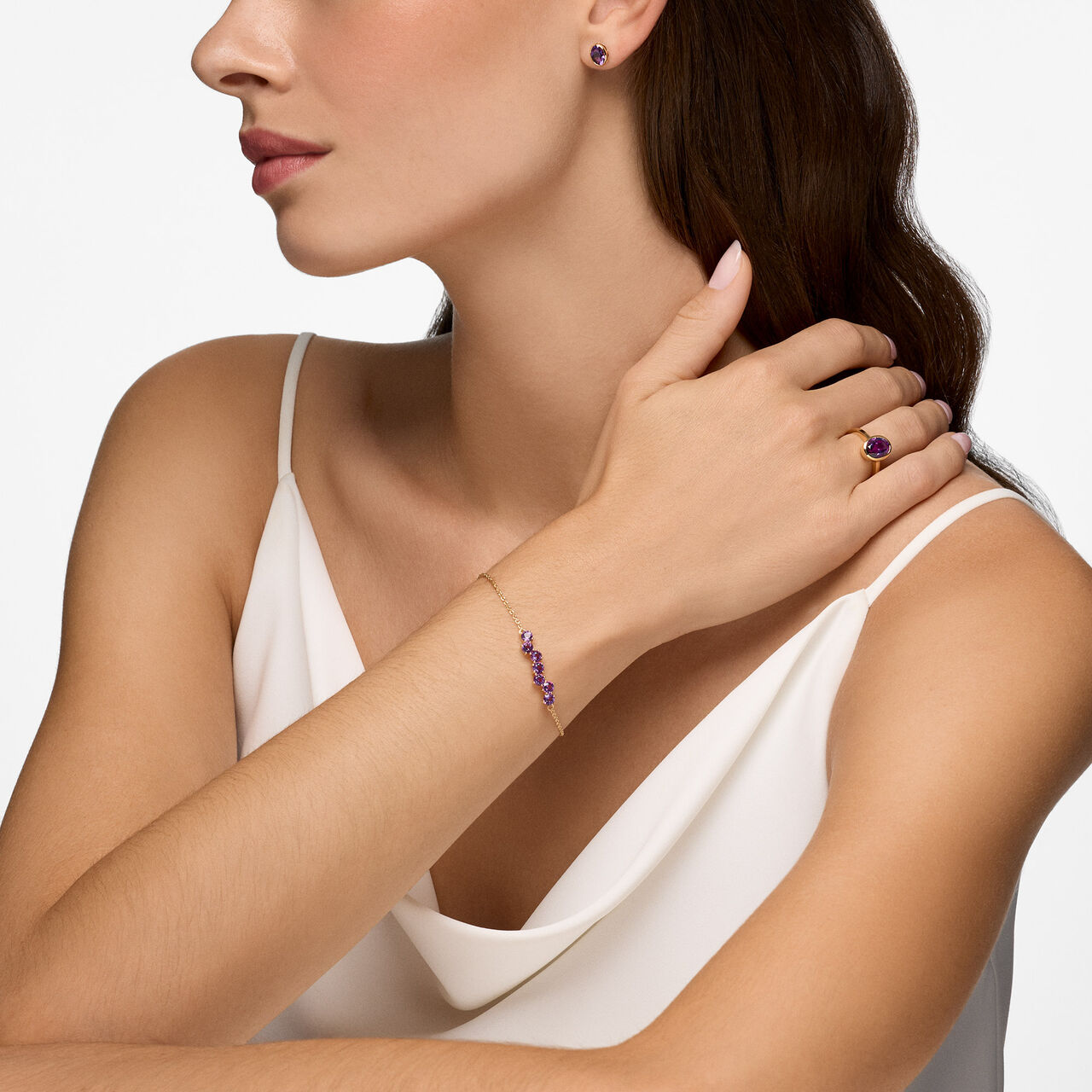 Amethyst jewellery set featuring earrings, ring, and bracelet in elegant design with purple gemstones. image number 1