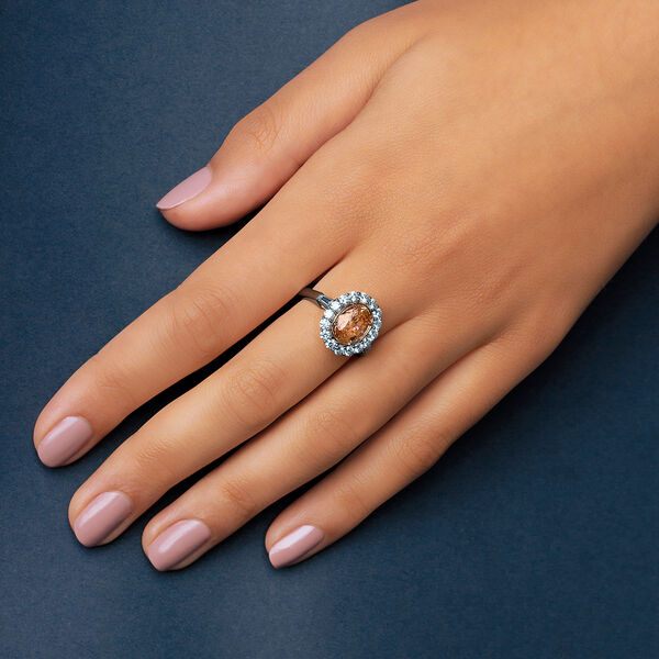 Oval Yellow-Orange Sapphire and Diamond Halo Ring