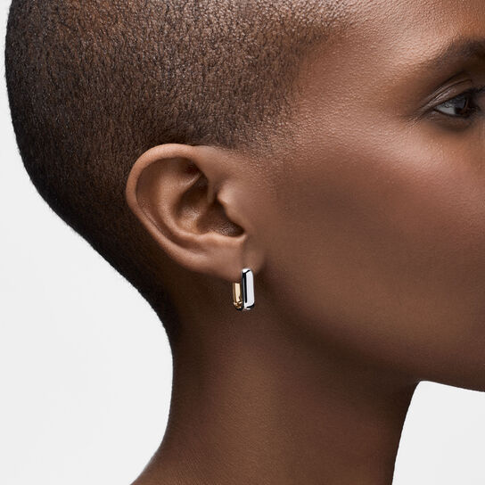 On-model view of Birks Essentials yellow and white gold hoops worn on the ear image number 1