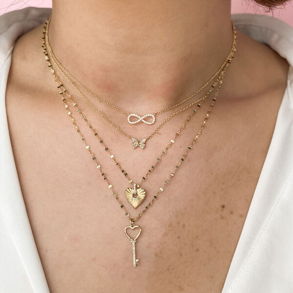 Pendentif Bezel Heart en or jaune avec pavé de diamant