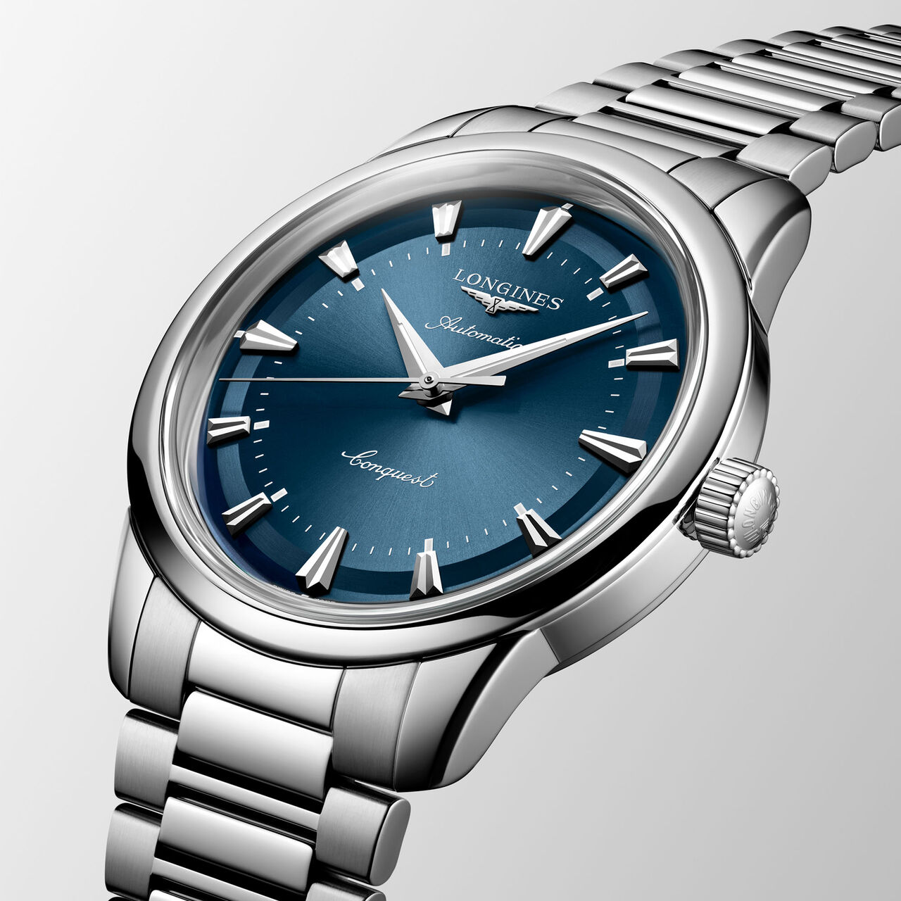 Side angle showing case thickness, blue dial, and stainless steel strap image number 1