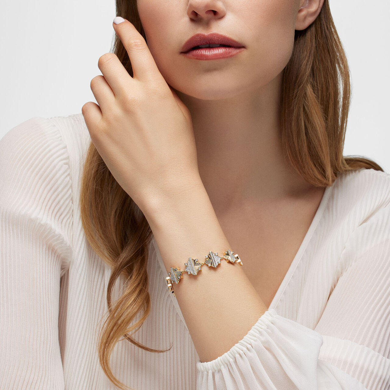 Birks Muse Exceptional Guilloché Yellow Gold and Diamond Bracelet on model image number 1