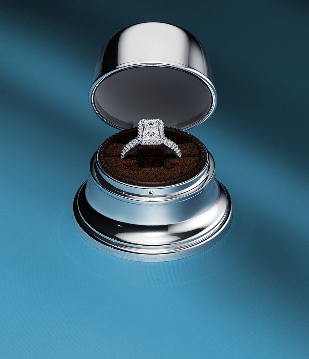 Birks solitaire diamond engagement rings on a blue background