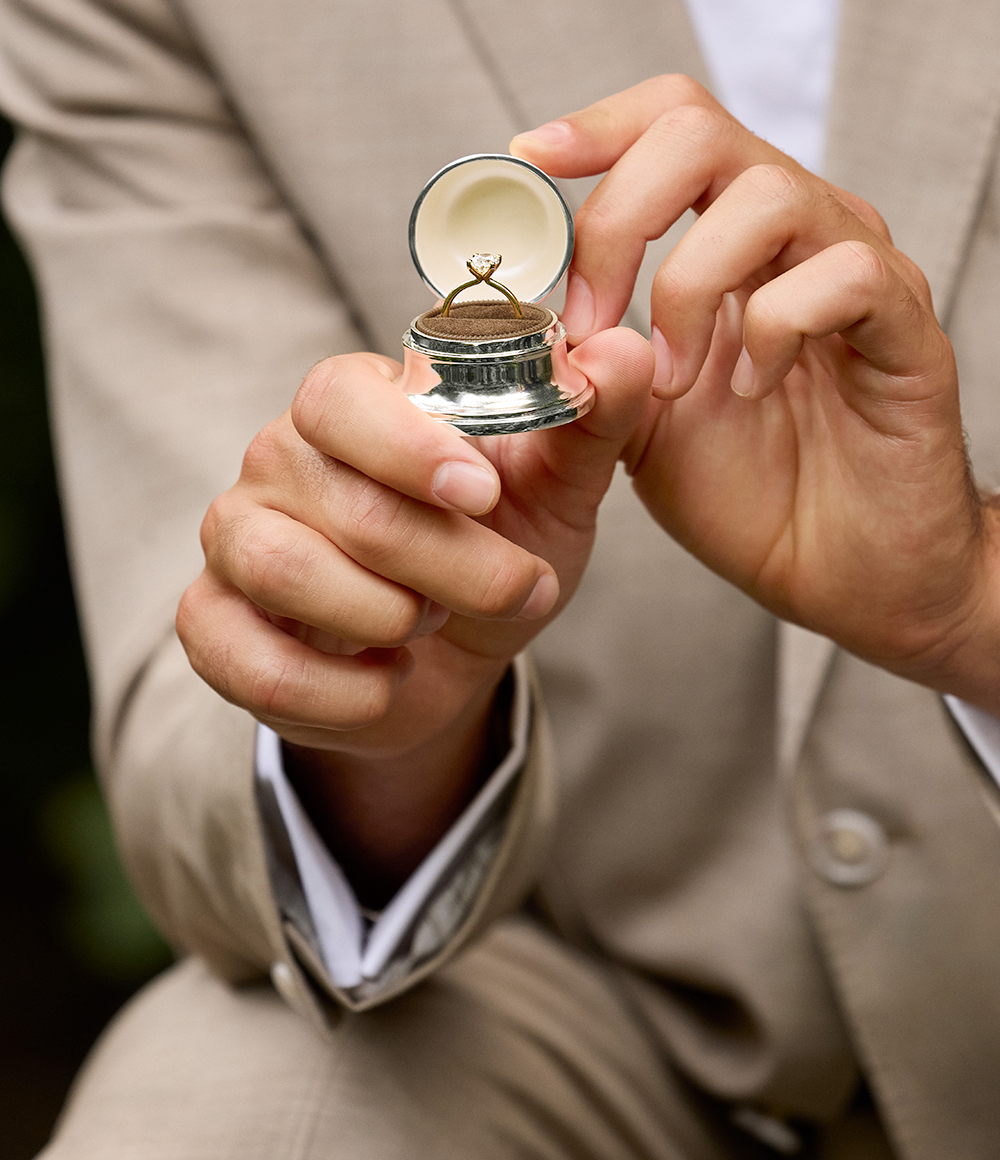 A man on one knee proposing